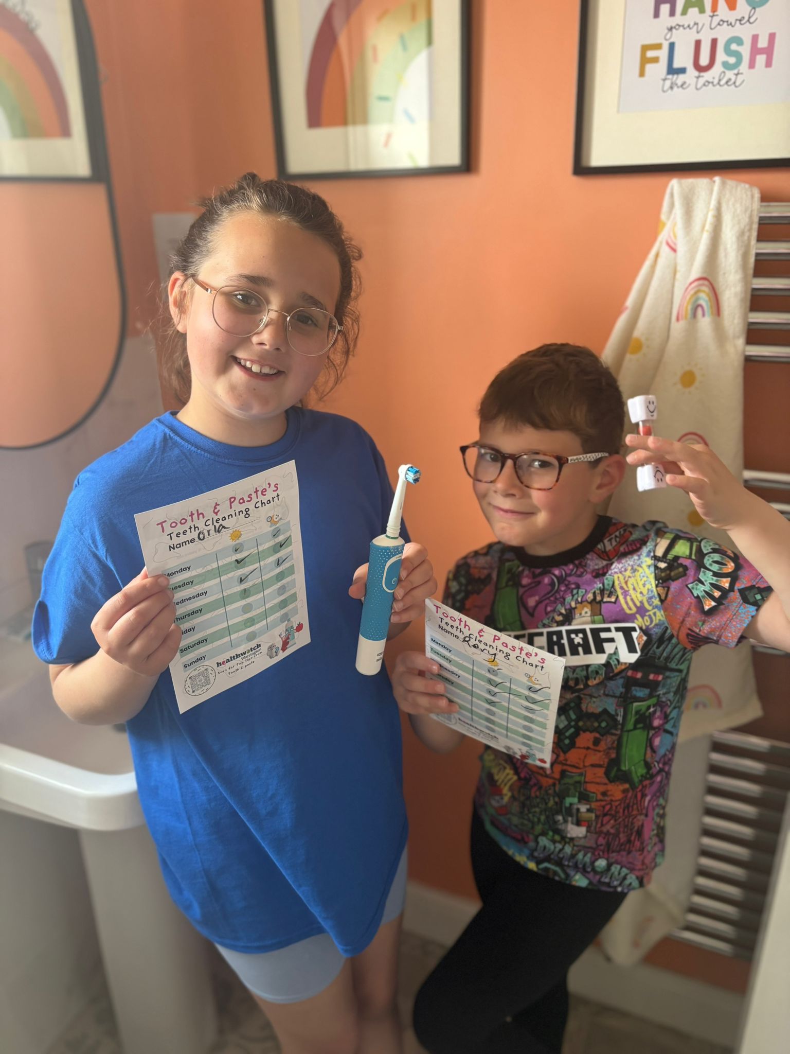 Orla & Rory enjoy their tooth cleaning chart