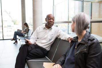 Woman and man sat having a conversation